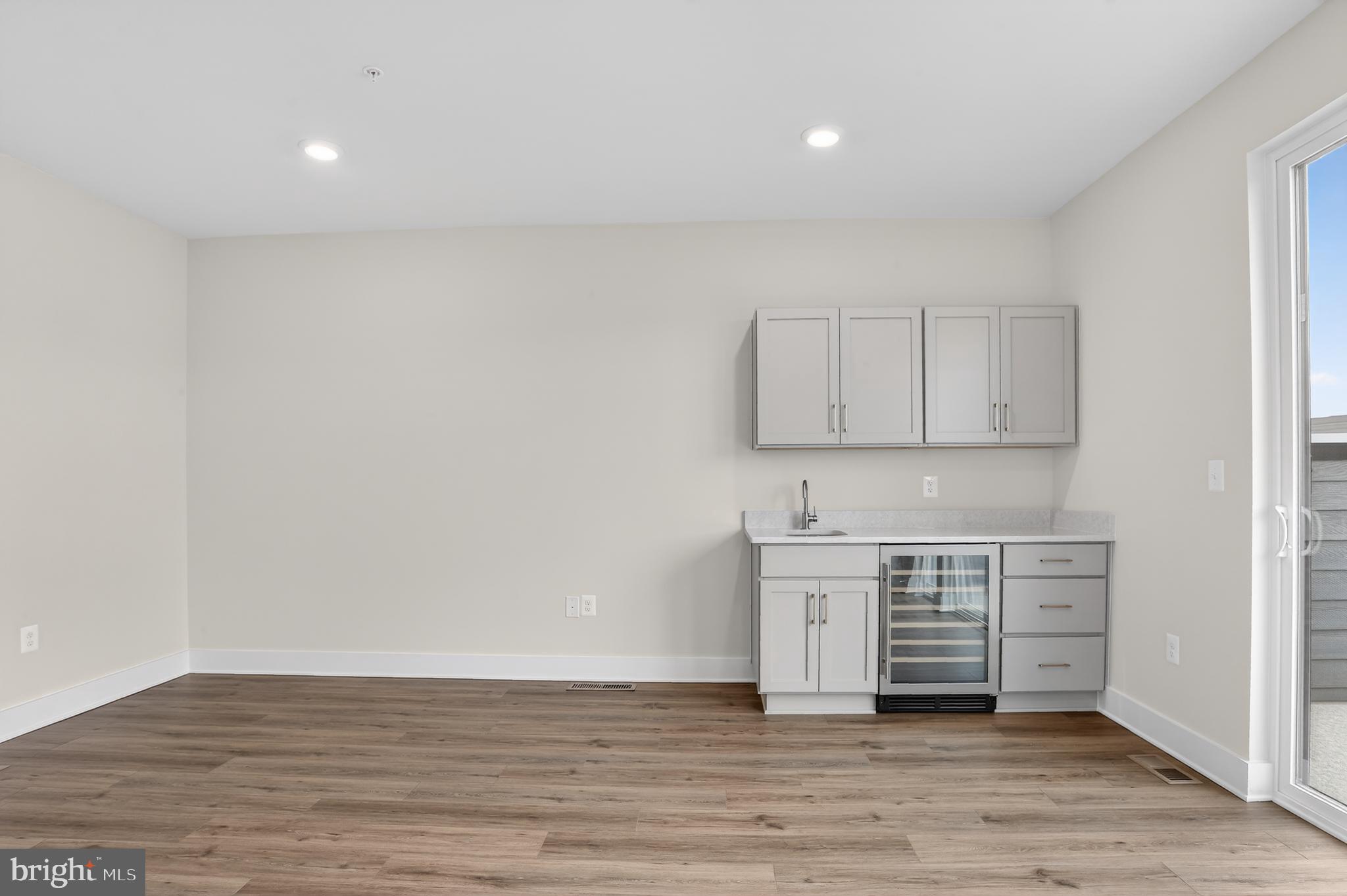 2710 Light Street Baltimore, MD 21230 - Photo 17 of 24 a view of an empty room with wooden floor and cabinet