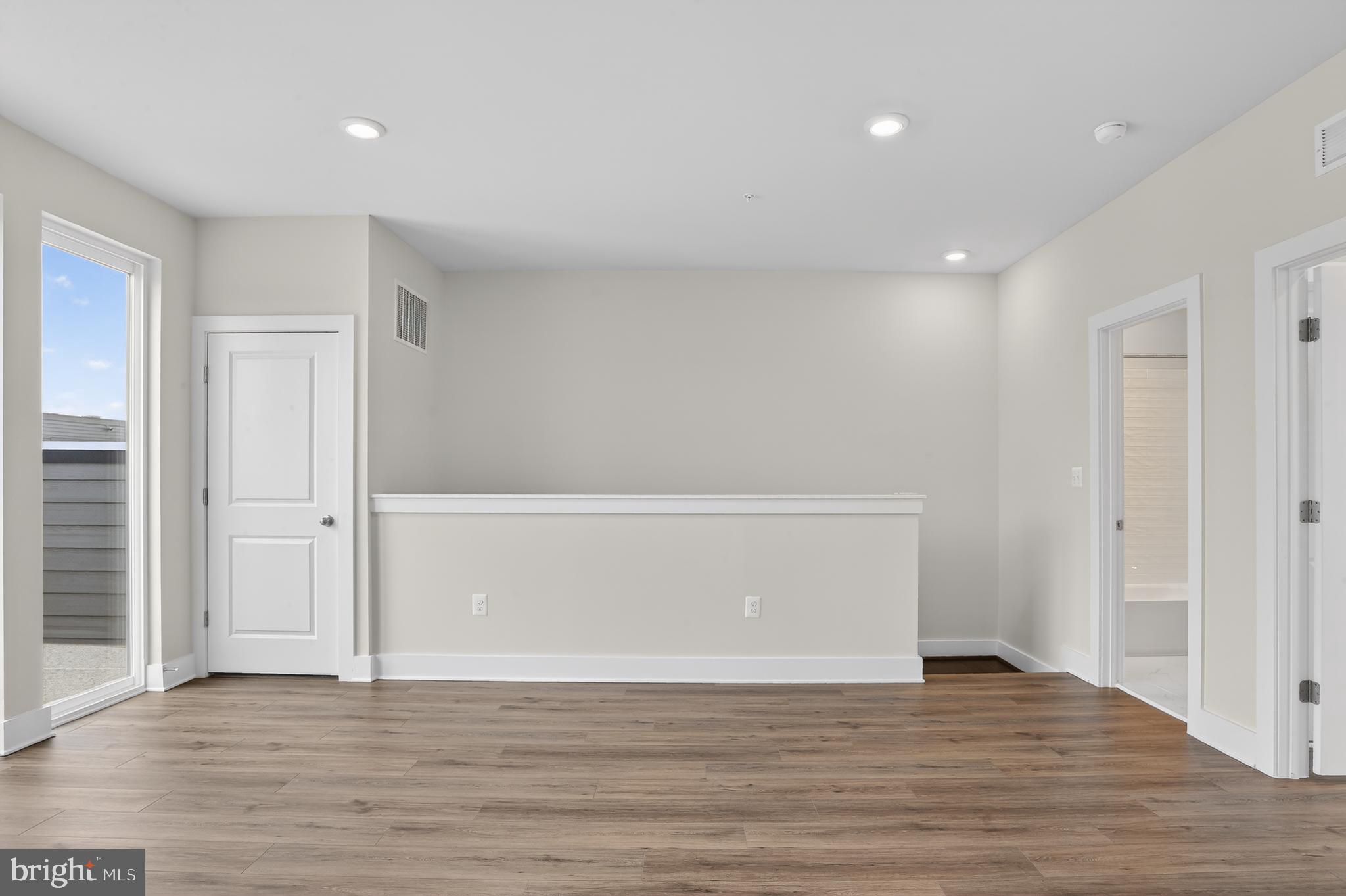 2710 Light Street Baltimore, MD 21230 - Photo 19 of 25 a view of an empty room with wooden floor