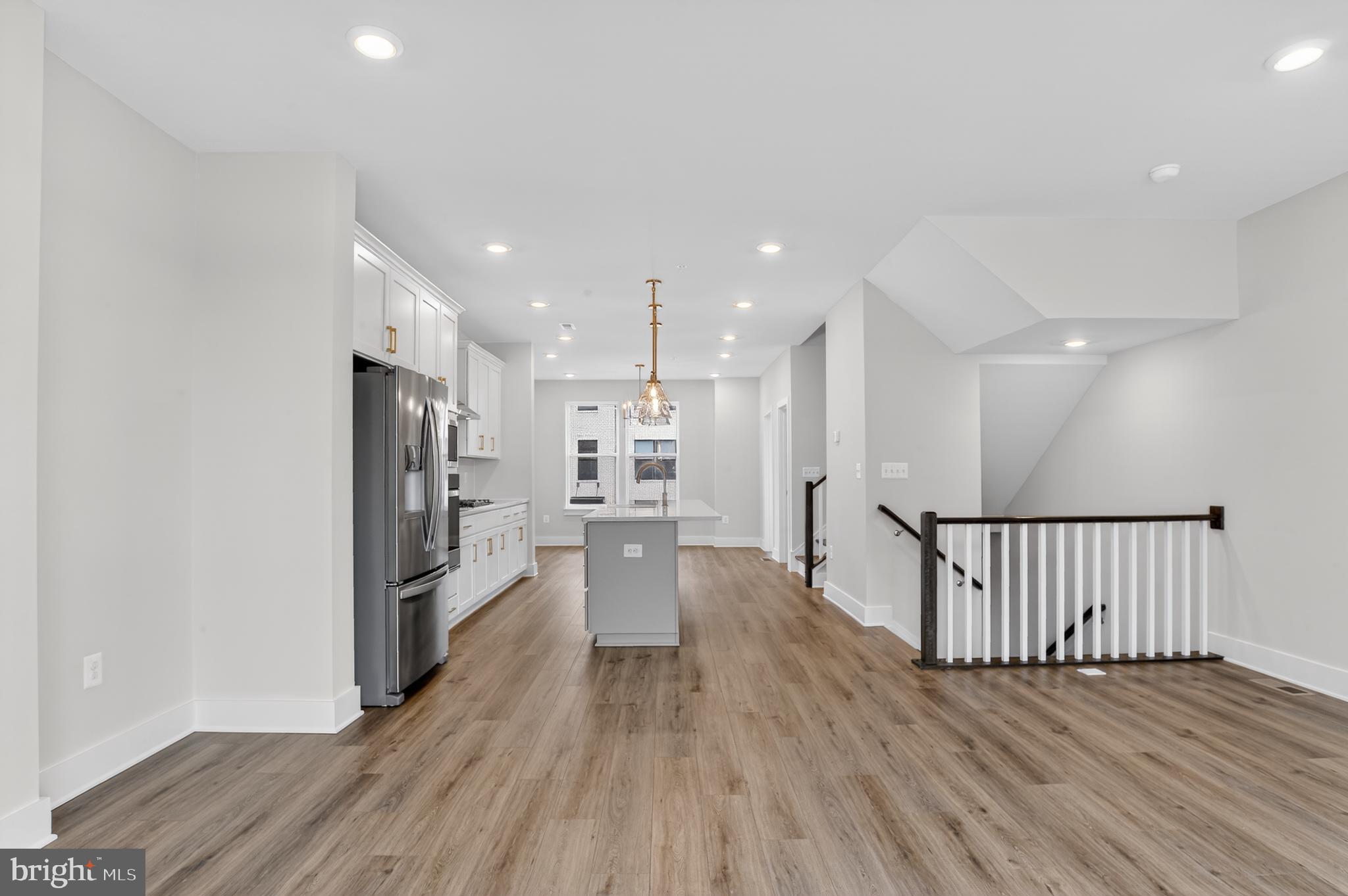 2710 Light Street Baltimore, MD 21230 - Photo 8 of 25 a view of a kitchen with wooden floor and a window