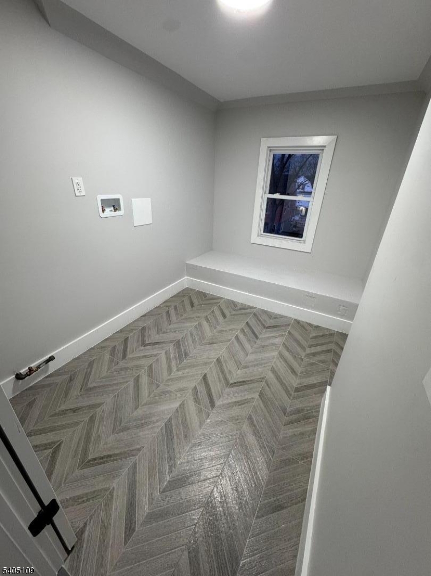 859 South 16th Street, Unit 2 Newark, NJ 07108 - Photo 11 of 14 a view of a room with wooden floor and windows
