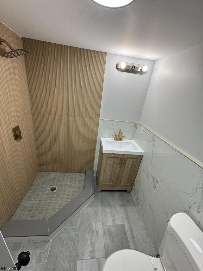 859 South 16th Street, Unit 2 Newark, NJ 07108 - Photo 7 of 14 a bathroom with a sink and a mirror