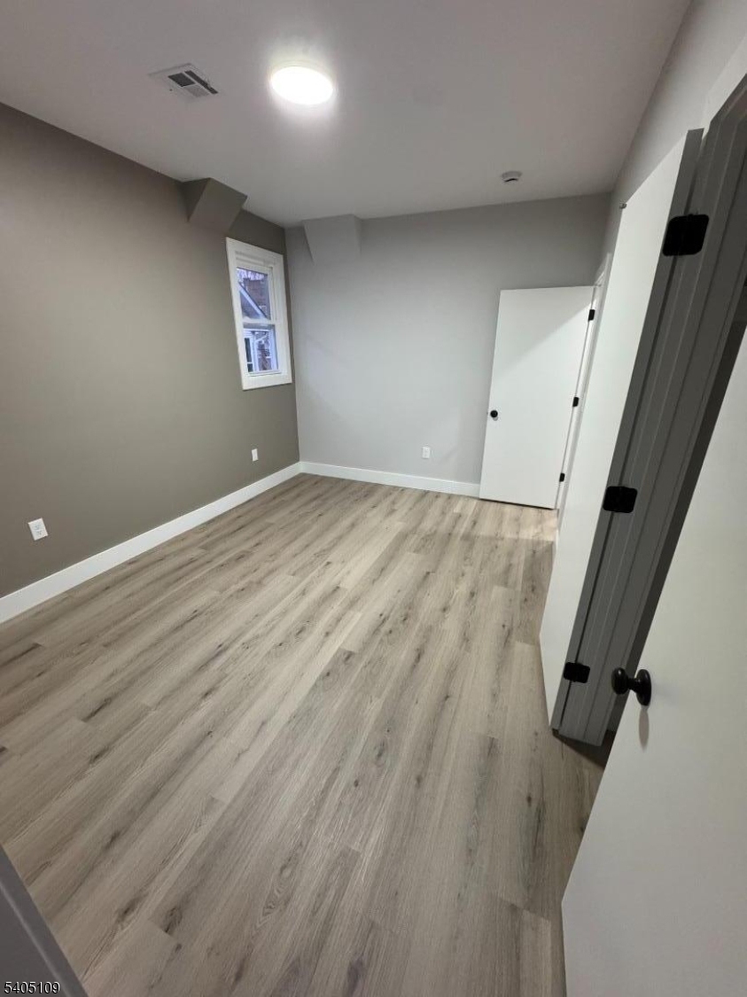 859 South 16th Street, Unit 2 Newark, NJ 07108 - Photo 10 of 14 an empty room with windows