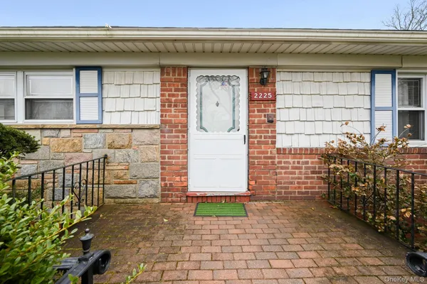 a front view of a house with a garage