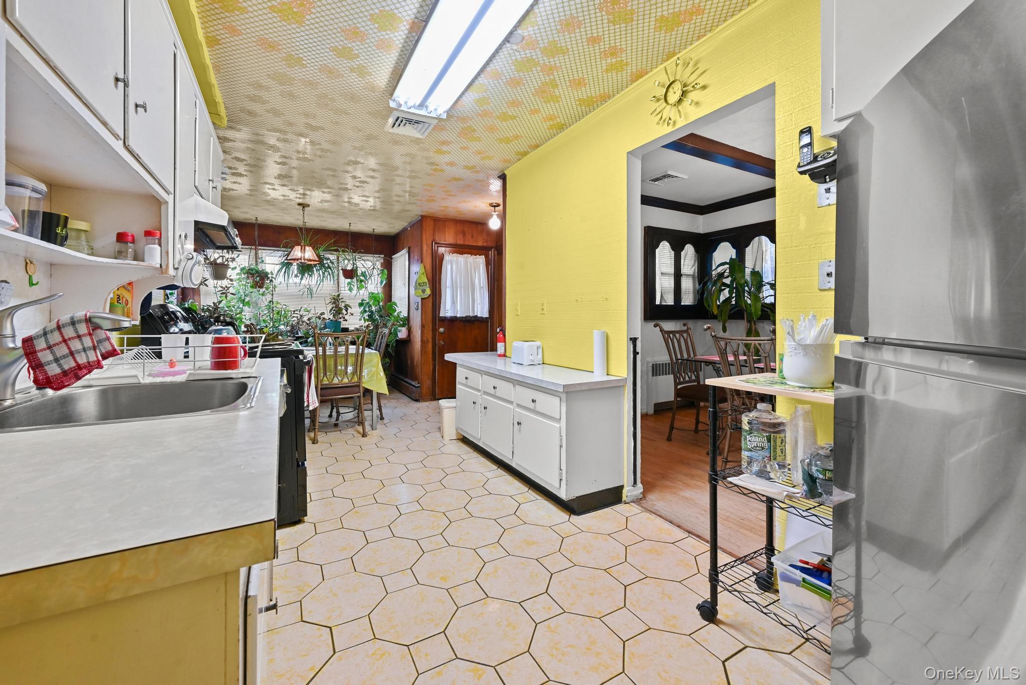 2225 Leighton Road Elmont, NY 11003 - Photo 11 of 26 a living room with furniture and a window