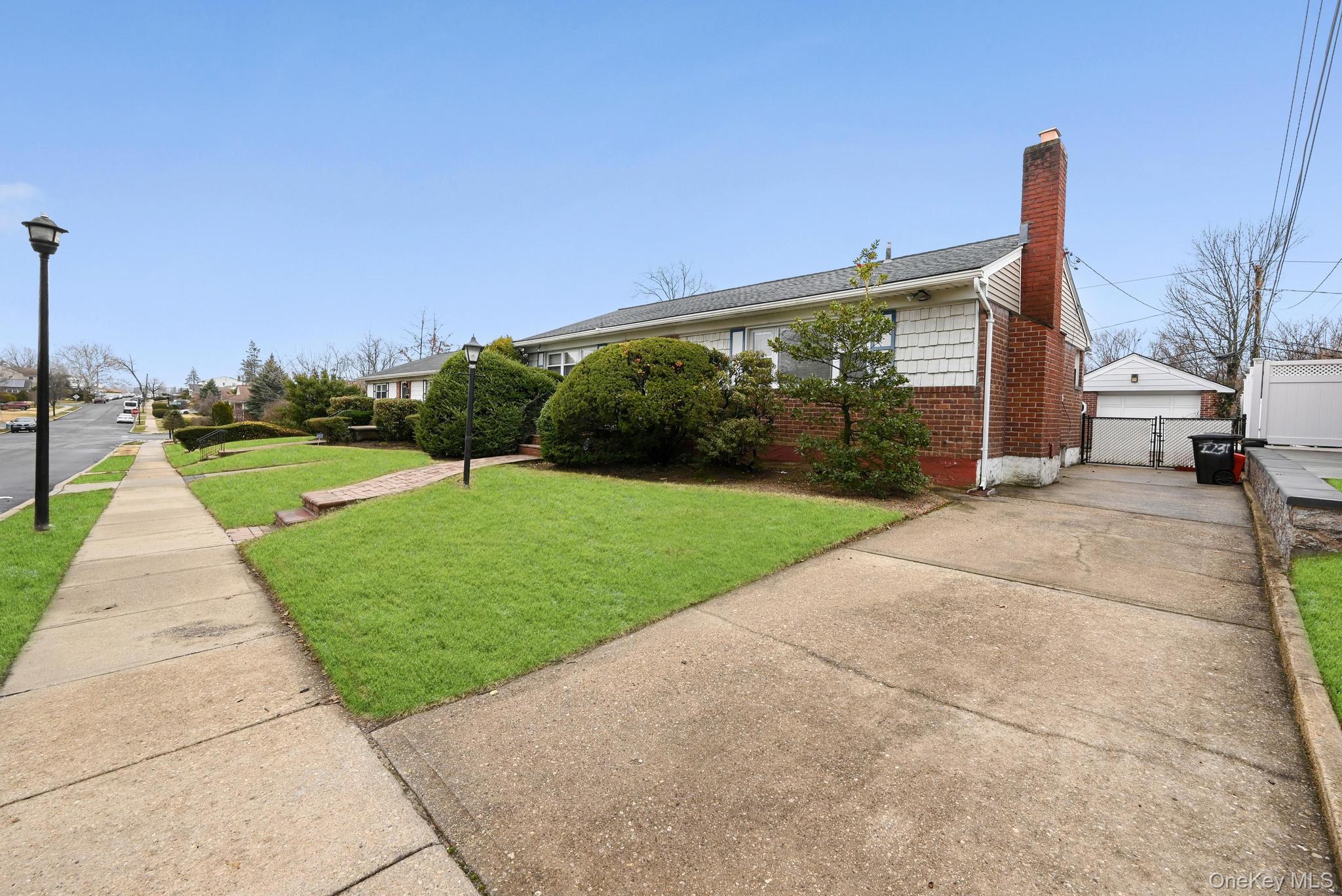 2225 Leighton Road Elmont, NY 11003 - Photo 4 of 26 a view of a park with large trees