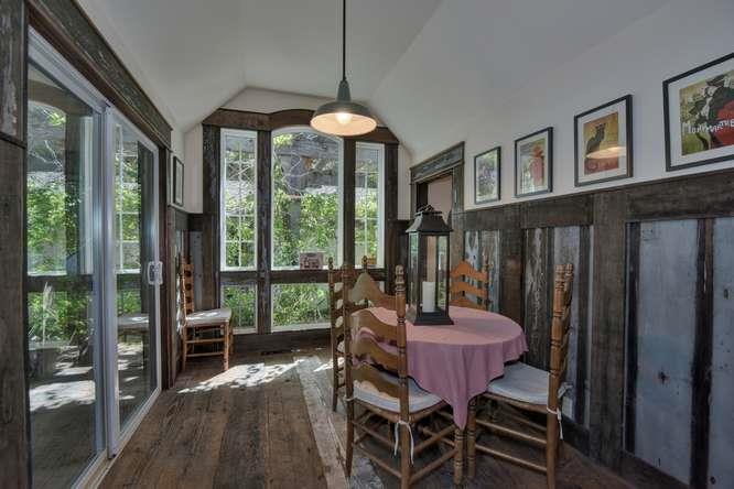 12455 Watsonville Road Gilroy, CA 95020 - Photo 17 of 49 a dining room with furniture a chandelier and wooden floor