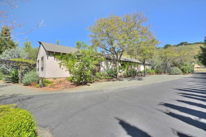 12455 Watsonville Road Gilroy, CA 95020 - Photo 19 of 49 a view of a street with a building in the background