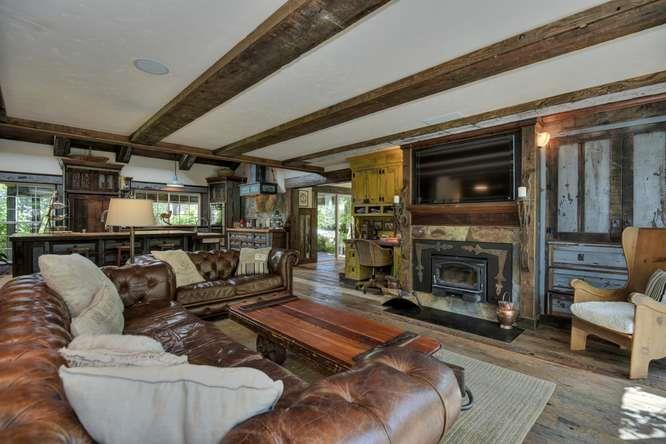 12455 Watsonville Road Gilroy, CA 95020 - Photo 27 of 49 a living room with furniture and a fireplace