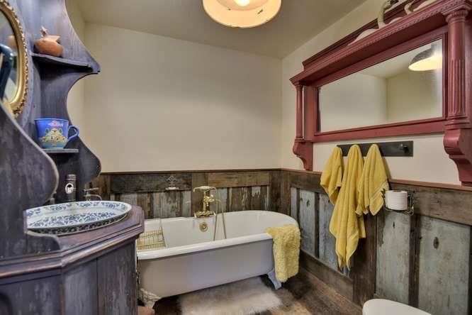 12455 Watsonville Road Gilroy, CA 95020 - Photo 28 of 49 a bathroom with a granite countertop sink and a mirror