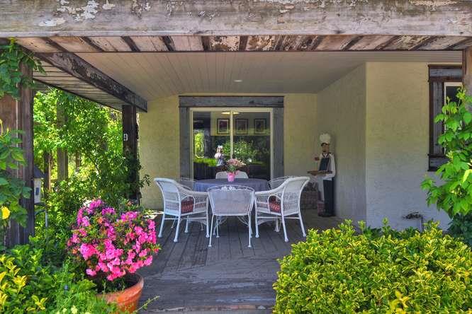 12455 Watsonville Road Gilroy, CA 95020 - Photo 39 of 49 a view of a patio with table and chairs and potted plants