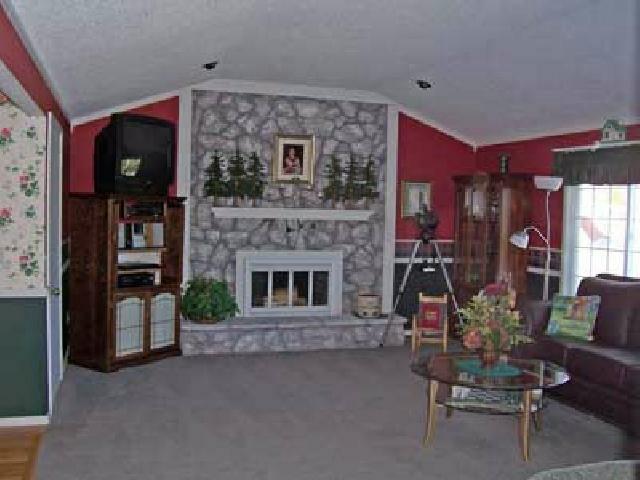 1504 Stein Road Yakima, WA 98908 - Photo 5 of 9 a living room with furniture and a fireplace