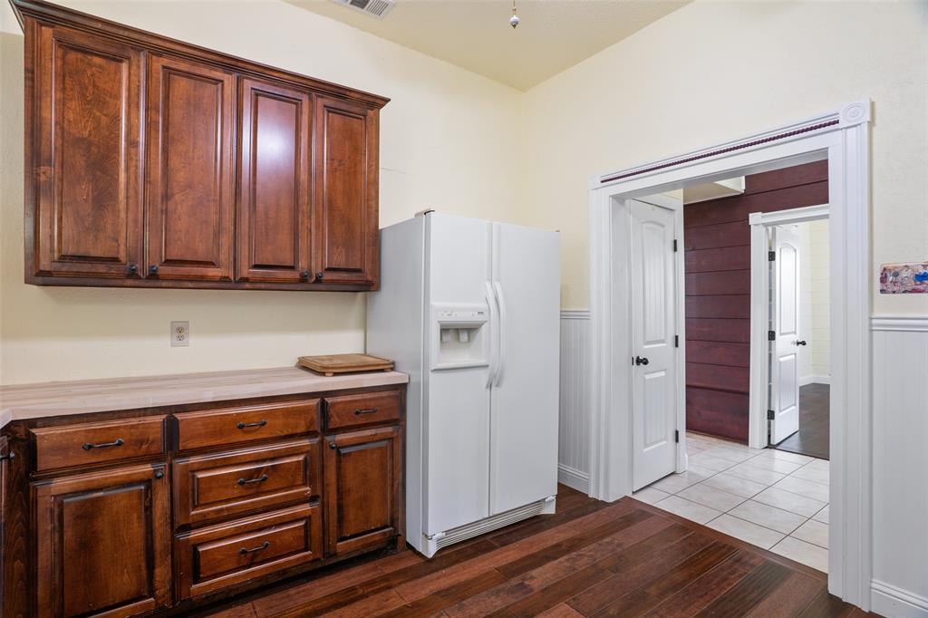 5824 Boone Street Sachse, TX 75048 - Photo 13 of 40 a view of cabinets with wooden floor and cabinet