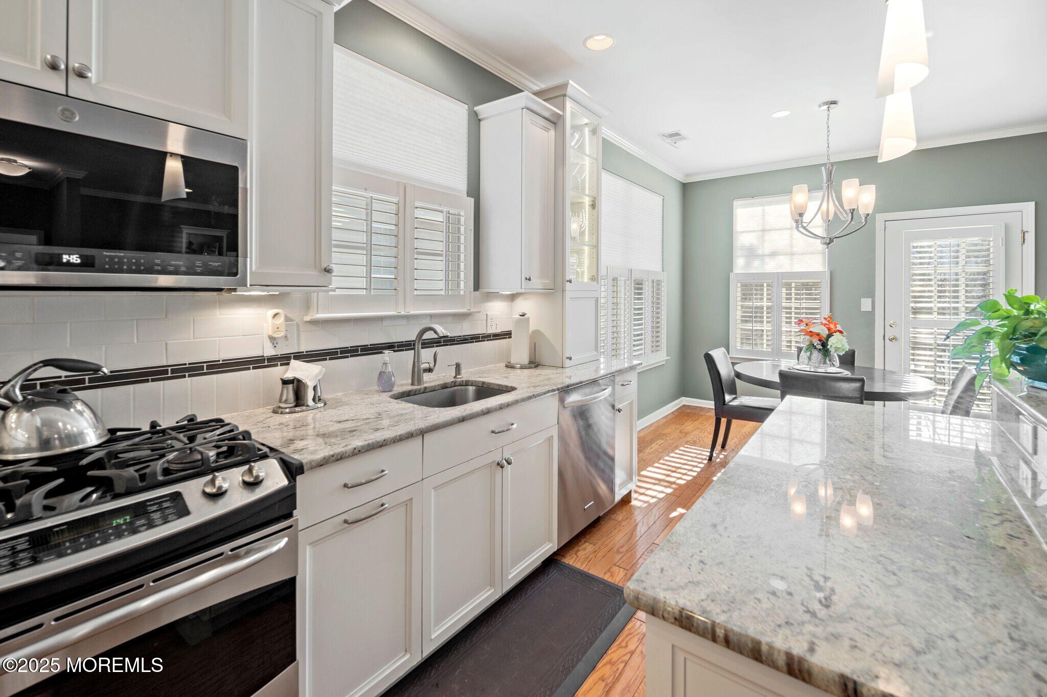 87 Pond View Circle Barnegat, NJ 08005 - Photo 22 of 66 a large kitchen with stainless steel appliances granite countertop a stove and a sink