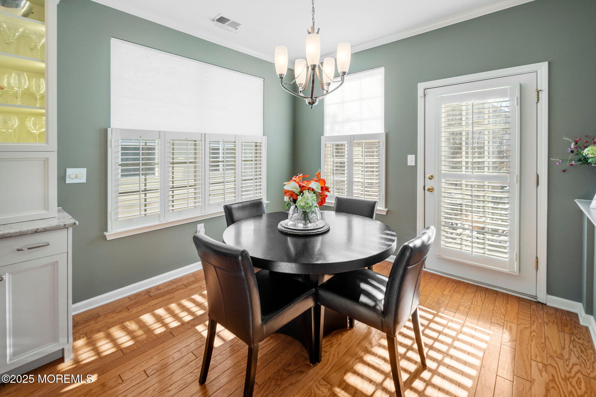 87 Pond View Circle Barnegat, NJ 08005 - Photo 25 of 66 a dining room with furniture a chandelier and wooden floor