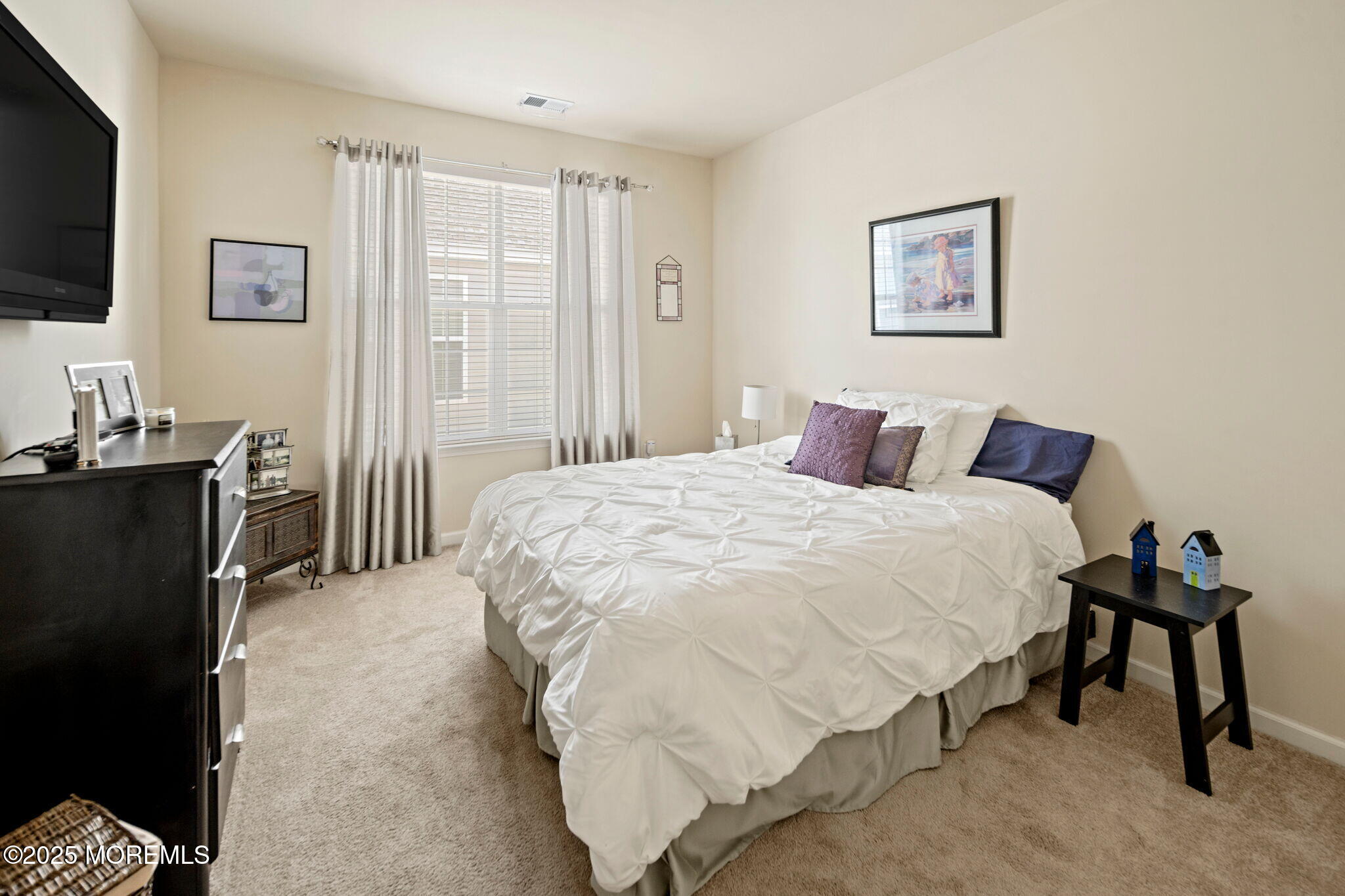 87 Pond View Circle Barnegat, NJ 08005 - Photo 41 of 66 a bedroom with a bed and a flat screen tv