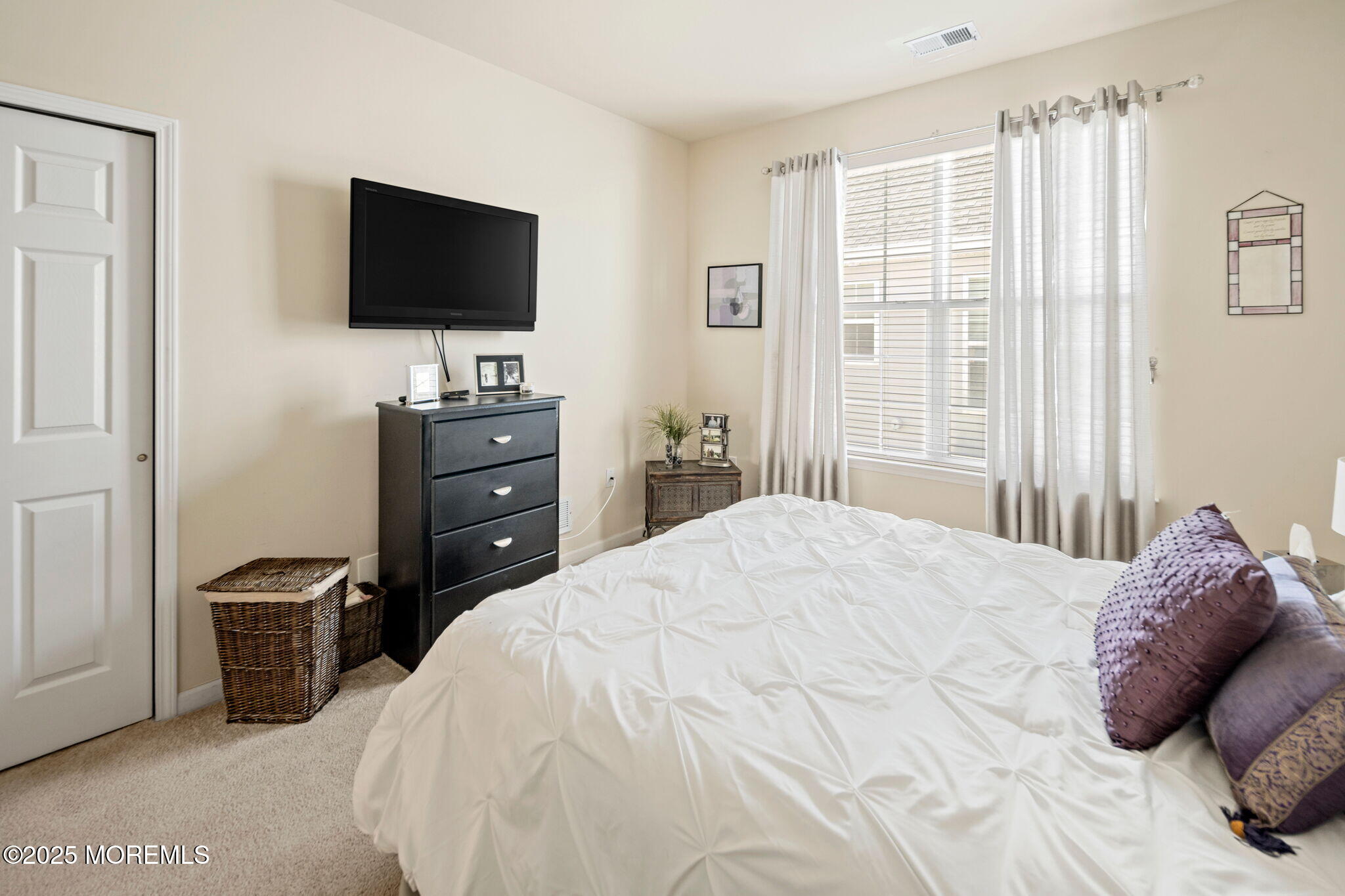 87 Pond View Circle Barnegat, NJ 08005 - Photo 42 of 66 a bedroom with a bed and a flat screen tv
