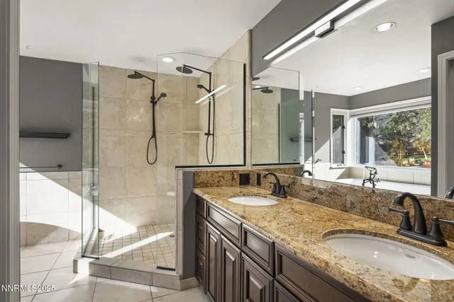 a view of an empty room with a window and a livingroom