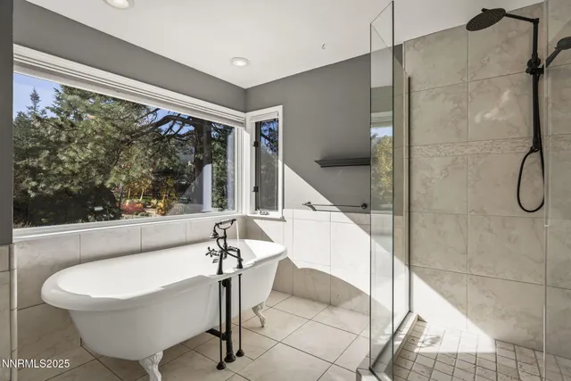 a bathroom with a granite countertop sink toilet mirror and shower