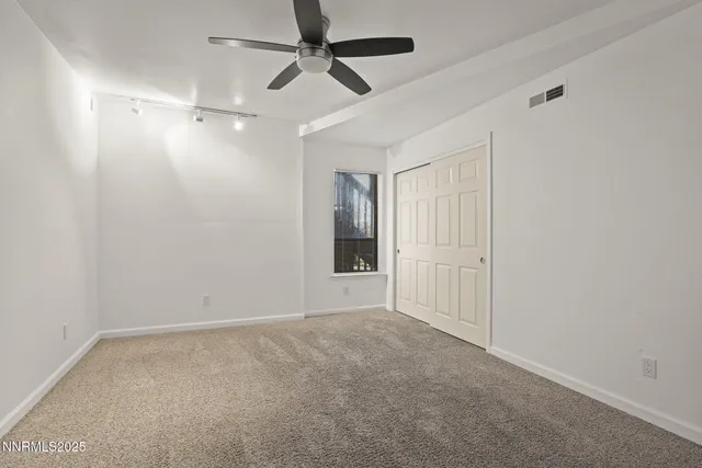 a view of a kitchen with wooden floor and cabinets