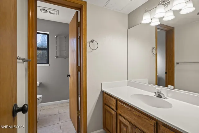 a view of a hallway with wooden shelves