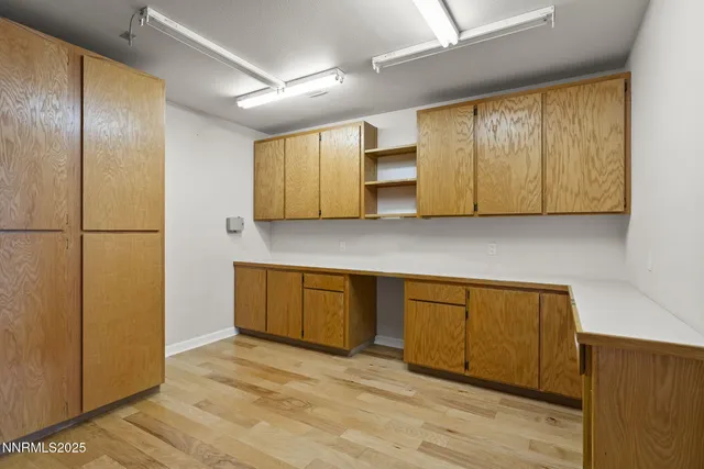 a view of a backyard with large trees