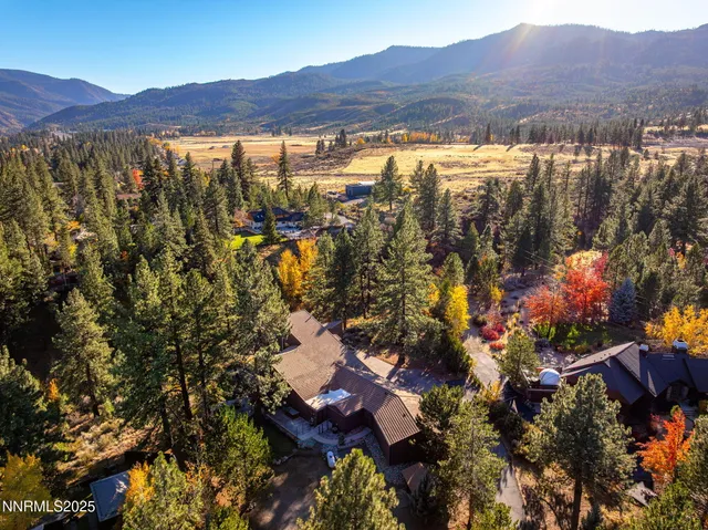 a view of a house with a yard and garage