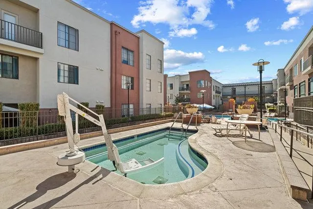 a view of a patio with swimming pool
