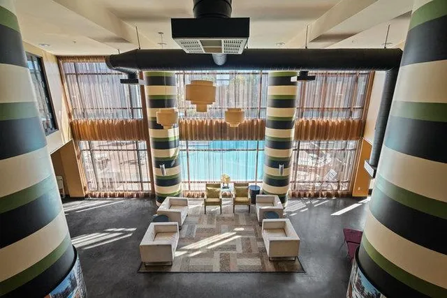 a view of a living room with furniture and wooden floor