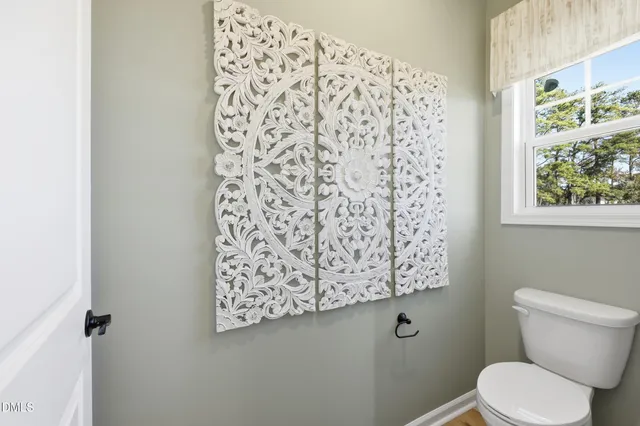 a view of a house with yard and tree s