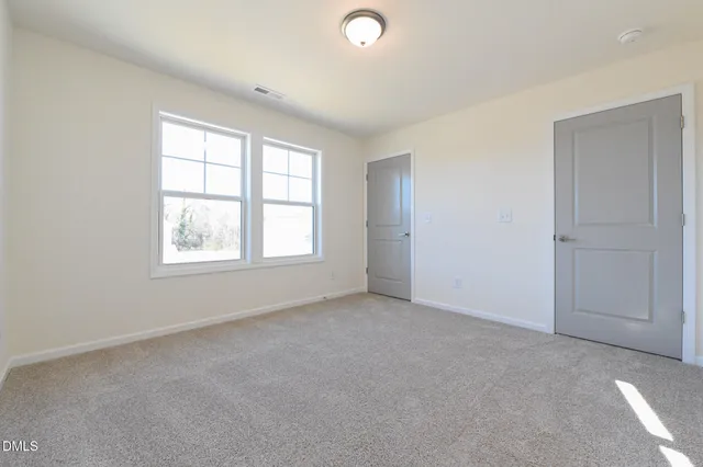a view of a balcony with wooden floor