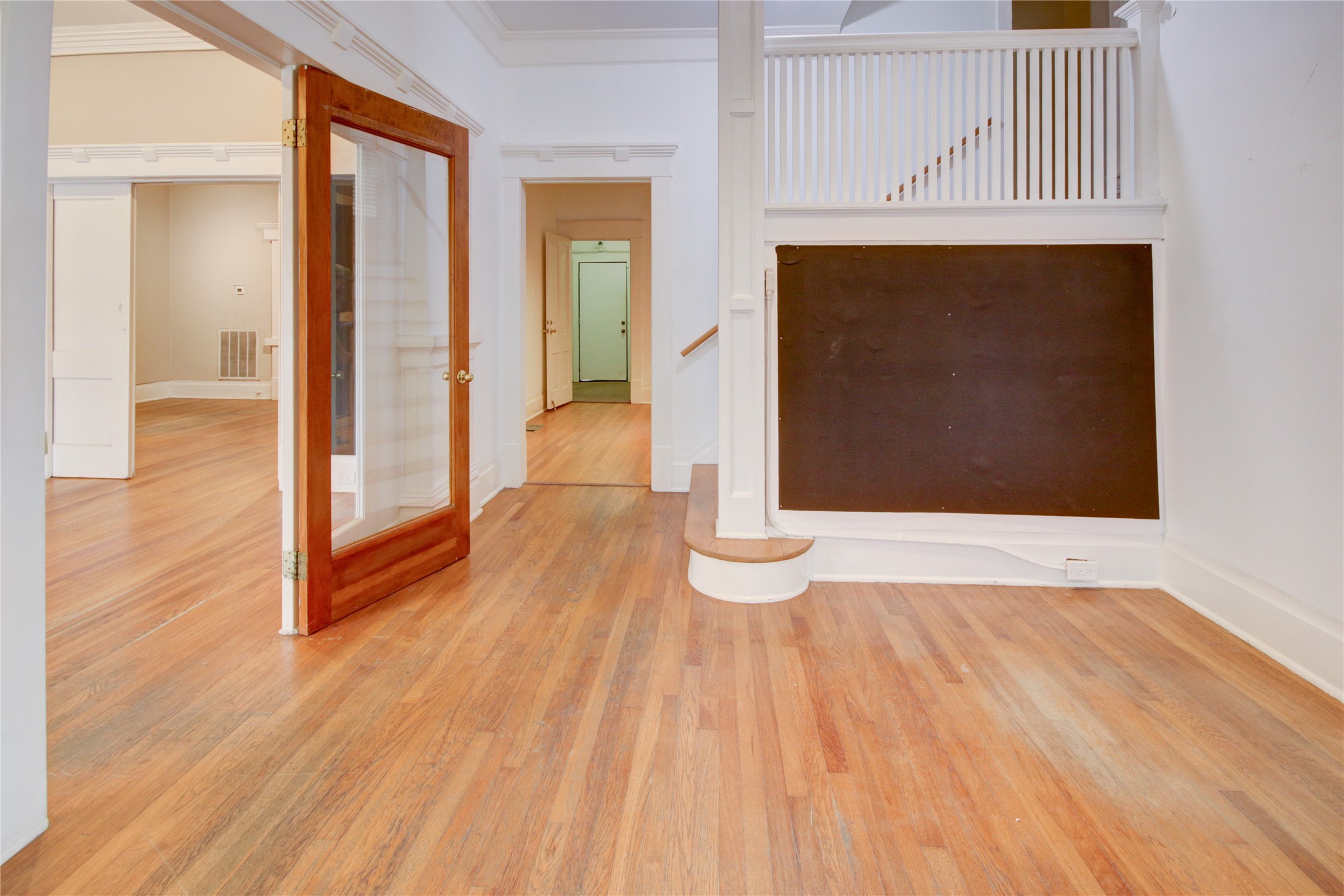 239 Westheimer Road Houston, TX 77006 - Photo 6 of 50 "The front door opens to a charming foyer adorned with elegant custom millwork and a fresh, modern color palette that sets a warm and inviting tone."