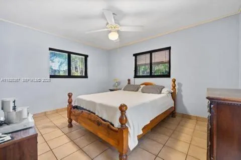 a kitchen with a refrigerator and cabinets