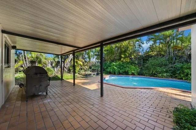 a view of swimming pool from a balcony