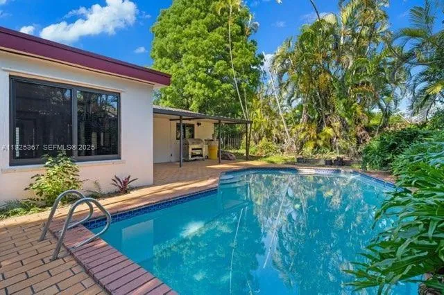 a view of a backyard with sitting area