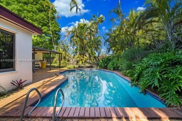 a bathroom with a toilet sink a shower and a mirror