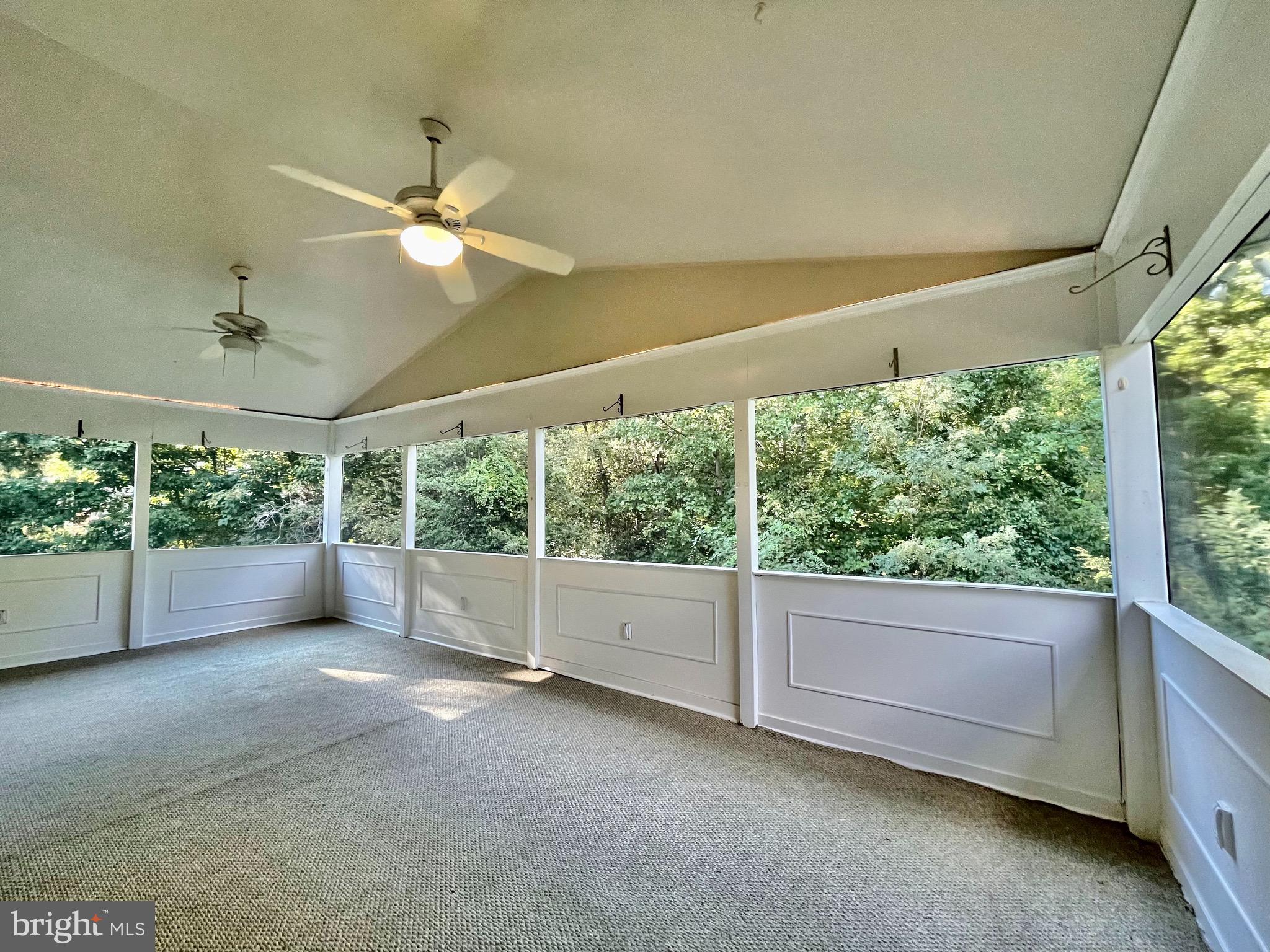 1270 Calvert Beach Road St. Leonard, MD 20685 - Photo 31 of 31 a view of room with large windows and ceiling fan