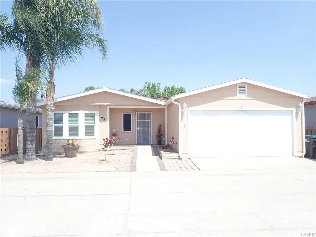 27250 Murrieta Road, Unit 75 Menifee, CA 92586 - Photo 1 of 29 a front view of a house with a outdoor space