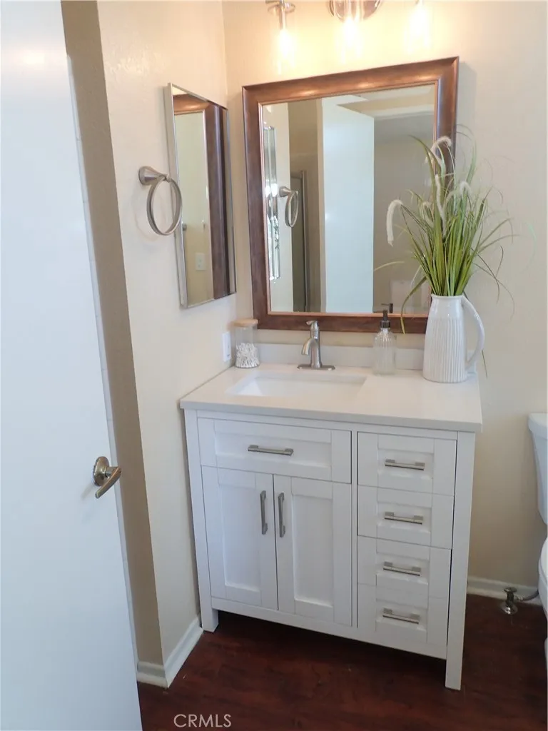 27250 Murrieta Road, Unit 75 Menifee, CA 92586 - Photo 14 of 29 a bathroom with a sink and a mirror