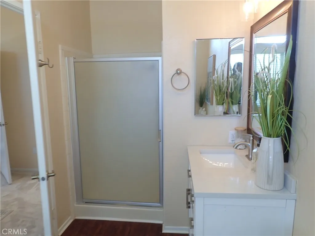 27250 Murrieta Road, Unit 75 Menifee, CA 92586 - Photo 15 of 29 a bathroom with a sink and a mirror