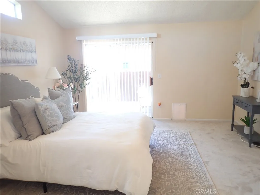 27250 Murrieta Road, Unit 75 Menifee, CA 92586 - Photo 16 of 29 a bedroom with a bed and a window