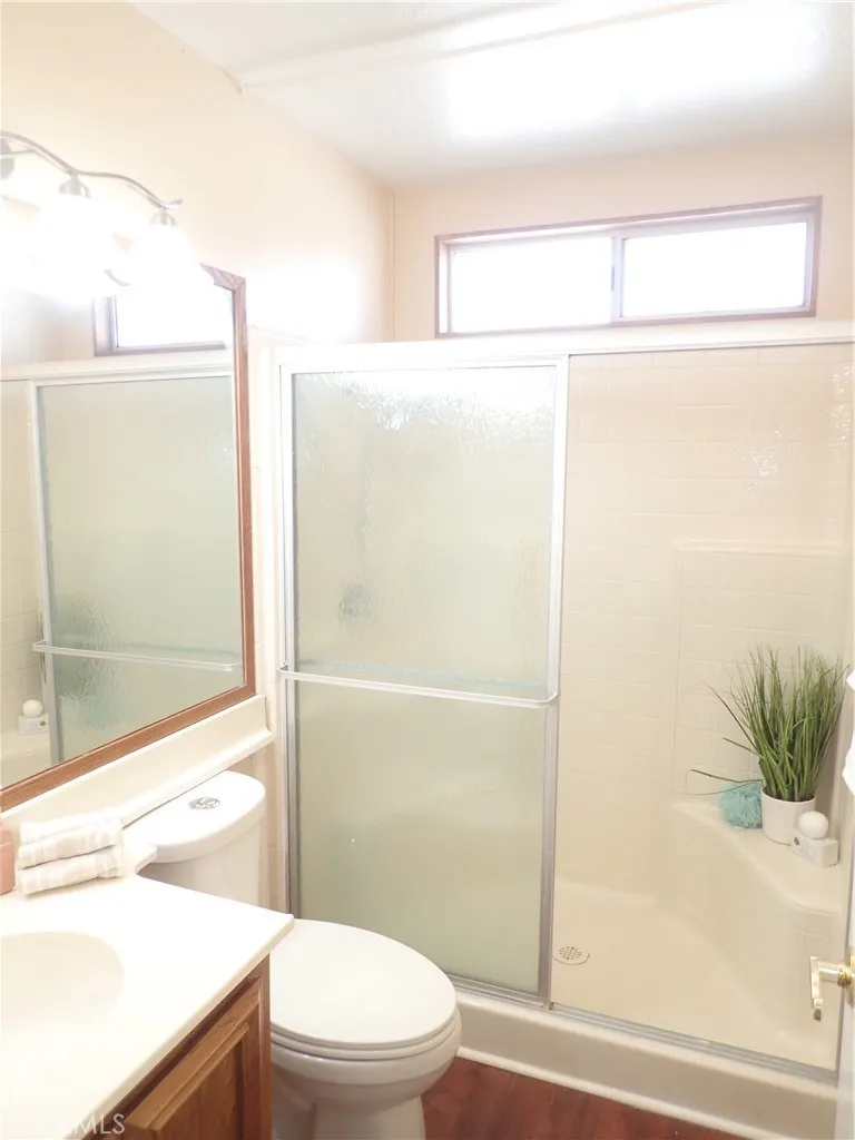 27250 Murrieta Road, Unit 75 Menifee, CA 92586 - Photo 19 of 29 a bathroom with a shower a toilet and a window