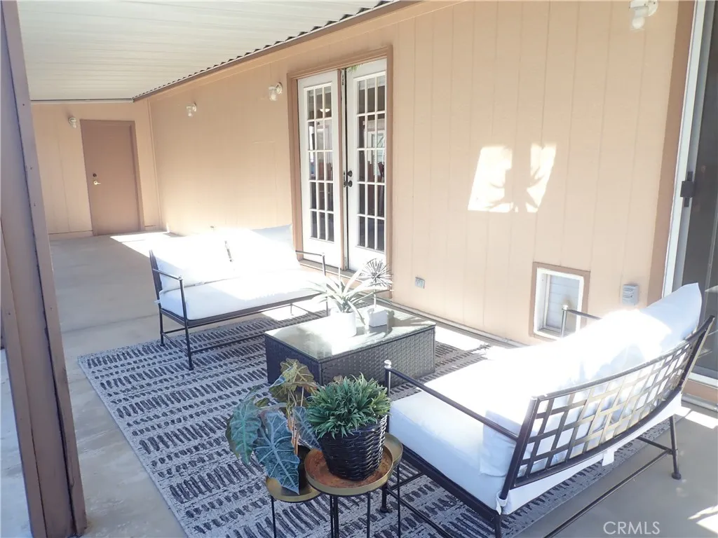27250 Murrieta Road, Unit 75 Menifee, CA 92586 - Photo 24 of 29 a view of a livingroom with furniture and window