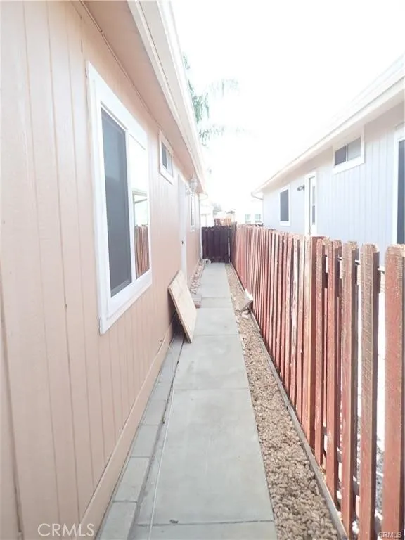 27250 Murrieta Road, Unit 75 Menifee, CA 92586 - Photo 29 of 29 a balcony with wooden floor stairs and furniture