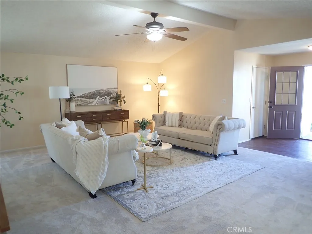 27250 Murrieta Road, Unit 75 Menifee, CA 92586 - Photo 9 of 29 a living room with furniture and a fireplace