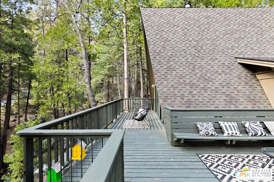 24601 Fern Valley Road Idyllwild, CA 92549 - Photo 40 of 50 a view of balcony with wooden floor and bench