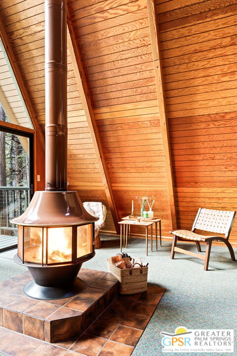 24601 Fern Valley Road Idyllwild, CA 92549 - Photo 8 of 50 a balcony with furniture and a potted plant