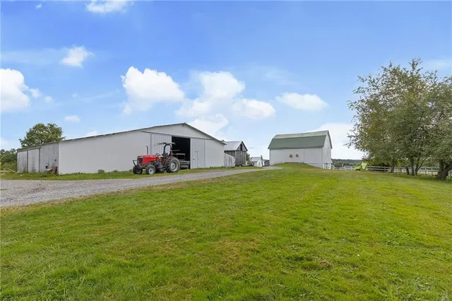 a backyard of a house with wooden fence