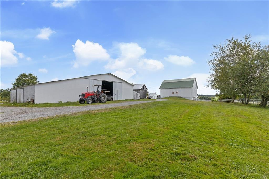 206 Lee Road Grove City, PA 16127 - Photo 11 of 45 a front view of house with yard and trees in the background