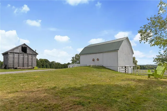a view of a house with backyard and entertaining space