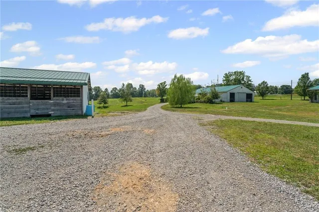 a view of a swimming pool with an outdoor seating and yard